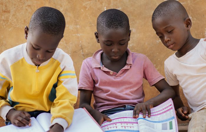 close up african kids reading together